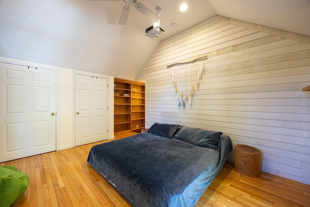 27 Fowler Street Upton, MA 01568 - Photo 19 of 36 a bedroom with a bed and wooden floor