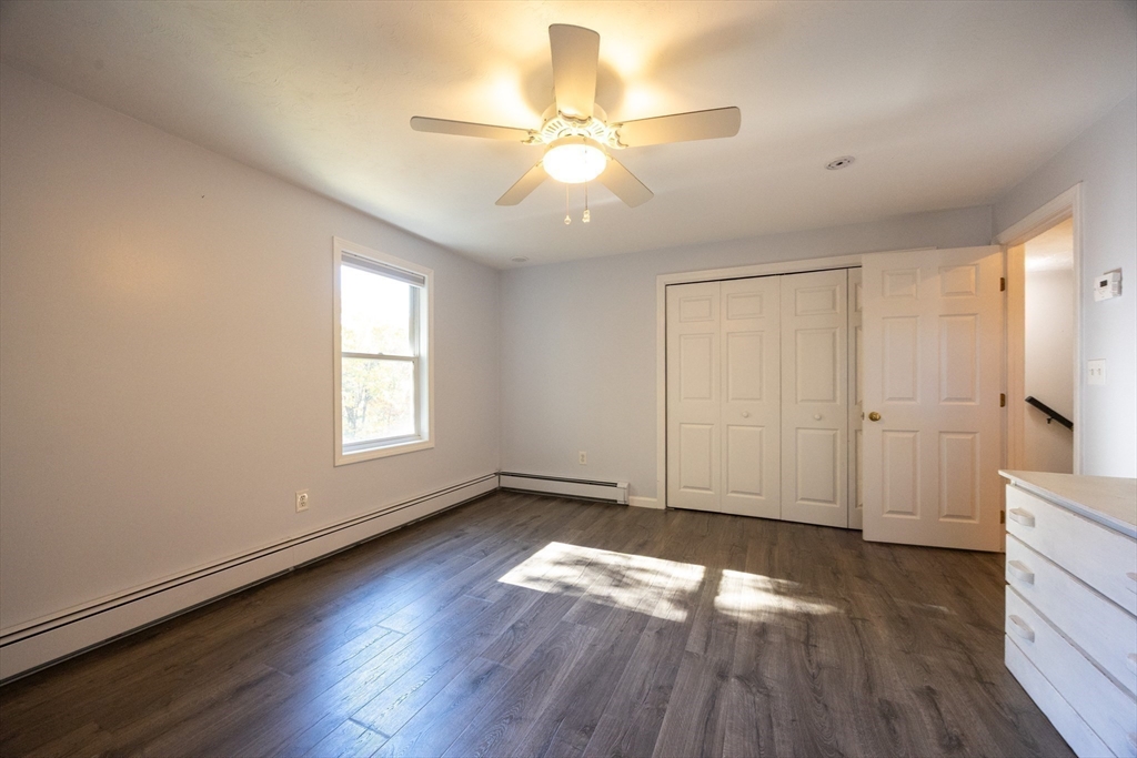 27 Fowler Street Upton, MA 01568 - Photo 24 of 36 wooden floor in an empty room with a window