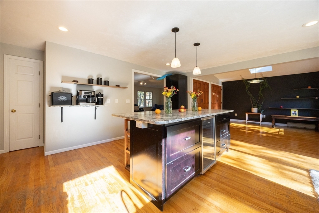 27 Fowler Street Upton, MA 01568 - Photo 5 of 36 a view of living room with stainless steel appliances kitchen island