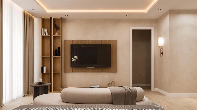 a bedroom with a bed and a television