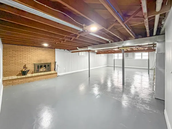 a view of a studio with wooden floor