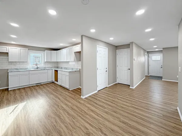 a view of kitchen with wooden floor