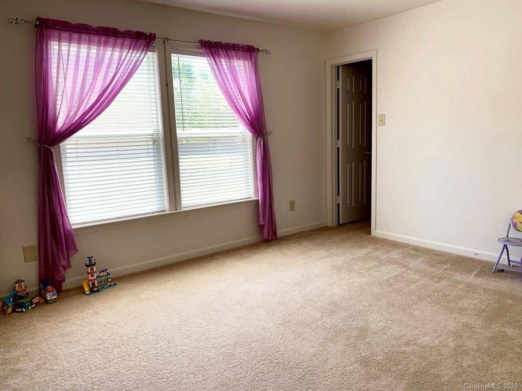 2517 Spring Breeze Way Monroe, NC 28110 - Photo 22 of 39 an empty room with windows