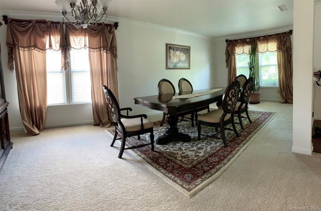 2517 Spring Breeze Way Monroe, NC 28110 - Photo 8 of 39 a living room with furniture and a large window