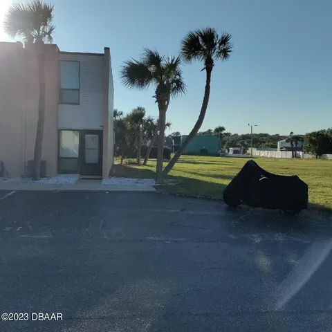 a view of a house with a yard and a sink