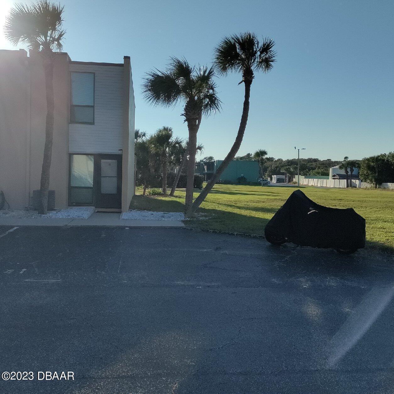 5500 Ocean Shore Boulevard, Unit 41 Ormond Beach, FL 32176 - Photo 2 of 9 a view of a house with a yard and a sink