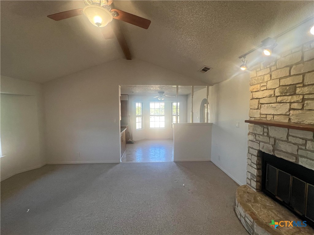 20239 Stillman Valley Road Florence, TX 76527 - Photo 13 of 35 wooden floor in an empty room with a fireplace