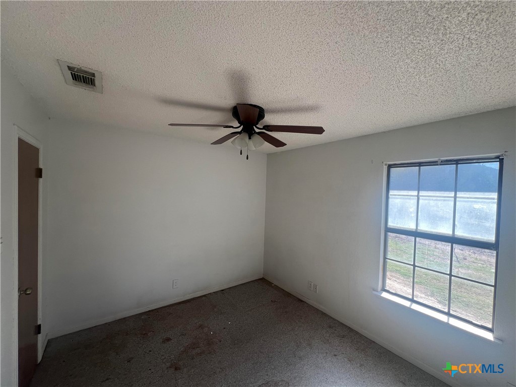 20239 Stillman Valley Road Florence, TX 76527 - Photo 15 of 35 an empty room with a window