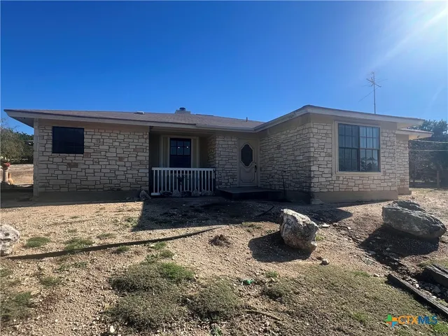 a view of a back yard of the house