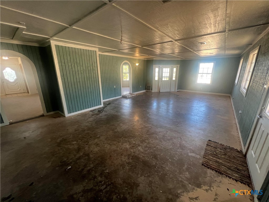 20239 Stillman Valley Road Florence, TX 76527 - Photo 7 of 35 a view of a livingroom with furniture and a floor to ceiling window