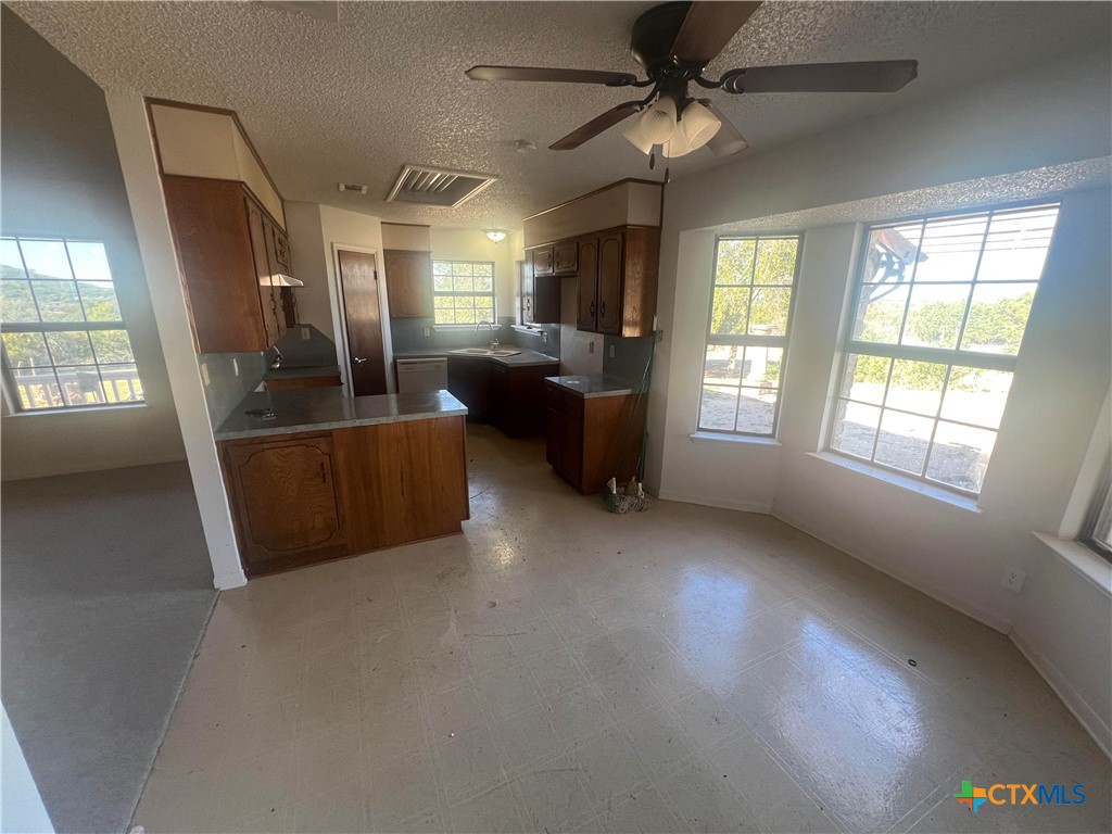 20239 Stillman Valley Road Florence, TX 76527 - Photo 9 of 35 a view of a livingroom with furniture hardwood floor and windows