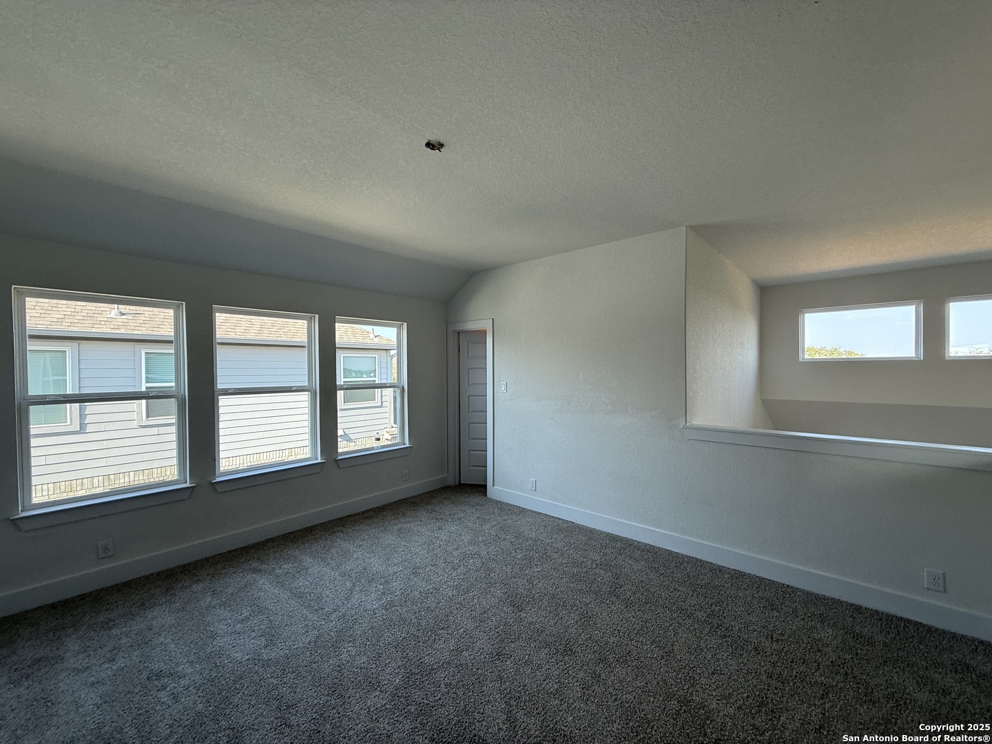 423 Glenwood Ranch Cibolo, TX 78108 - Photo 13 of 33 an empty room with a empty space and windows