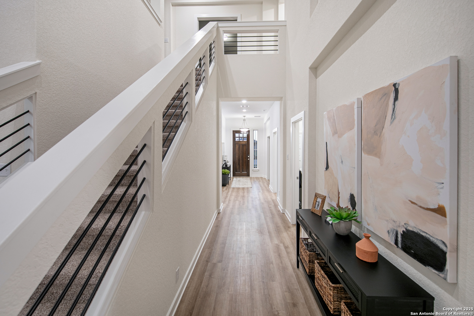 423 Glenwood Ranch Cibolo, TX 78108 - Photo 22 of 33 a view of a hallway with wooden floor and stairs