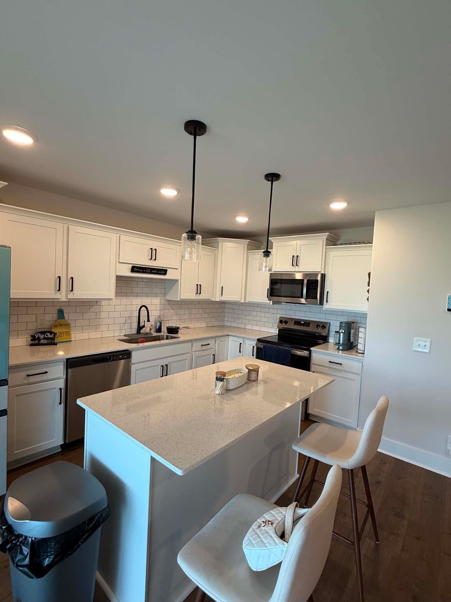 1191 Southside Road Southside, TN 37171 - Photo 17 of 34 a kitchen with a sink a stove and chairs