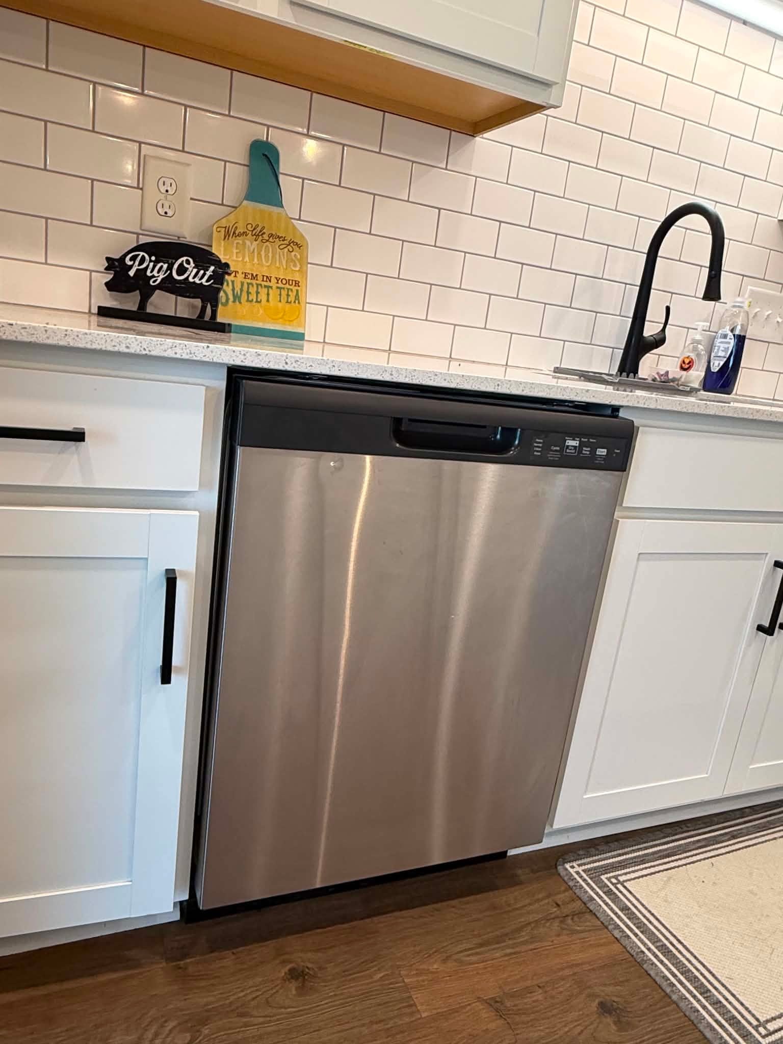 1191 Southside Road Southside, TN 37171 - Photo 19 of 34 a close view of a sink and dishwasher with wooden floor