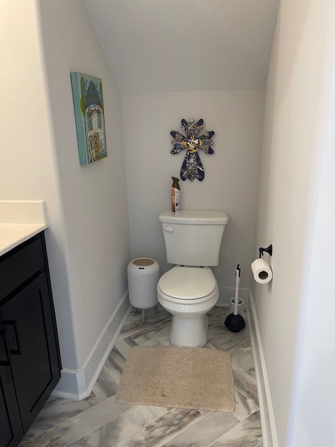1191 Southside Road Southside, TN 37171 - Photo 21 of 34 a white toilet sitting next to a bathroom sink and vanity