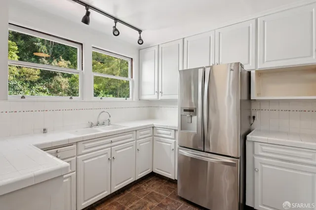 a bathroom with a sink a mirror and a toilet