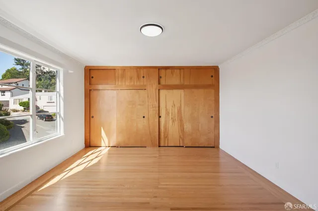 a bathroom with a sink mirror and a toilet