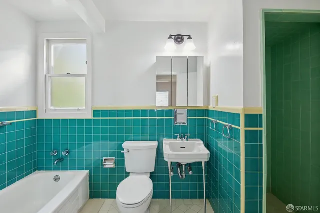 a backyard of a house with a table and chairs