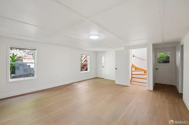a view of balcony with wooden floor and fence