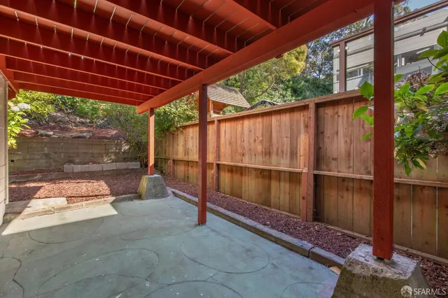 a view of balcony with wooden floor and fence
