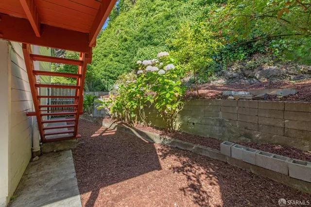 a view of a brick house with an outdoor space