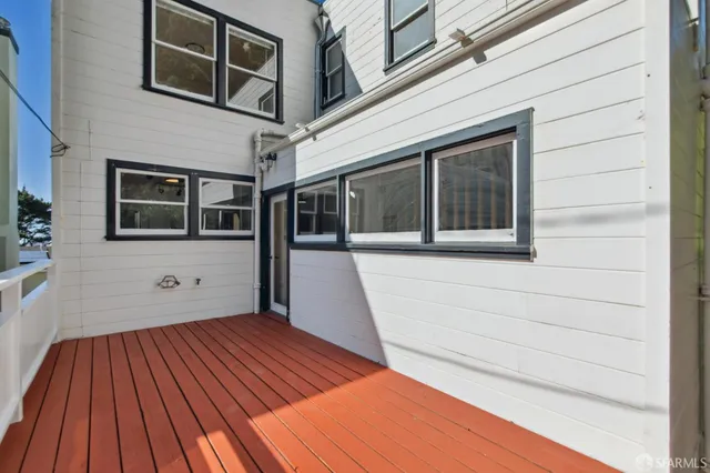a aerial view of a house with swimming pool and sitting area