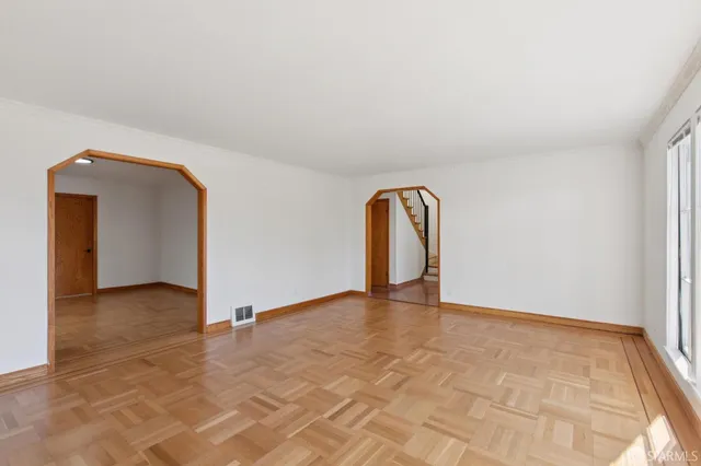 a view of a room with a sink and cabinets