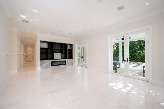 a room with a desk and a window