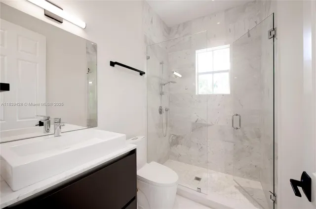 a large bedroom with a large bed and dresser