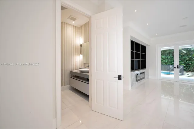 a large kitchen with stainless steel appliances a large counter top and a stove