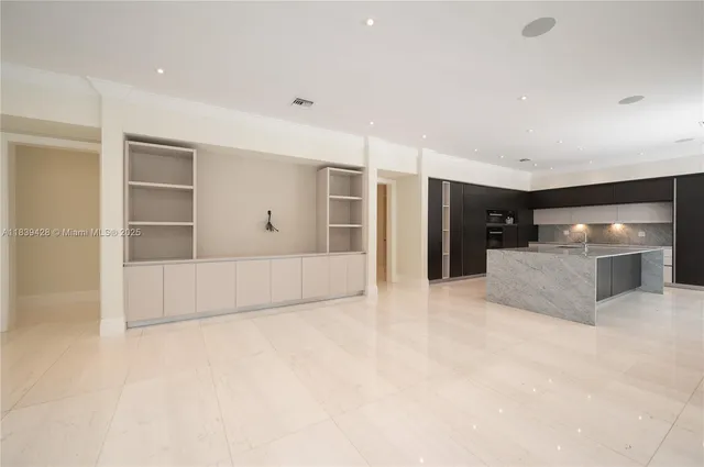 a kitchen with stainless steel appliances a refrigerator and a sink