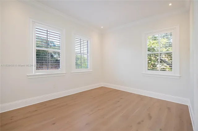 a spacious bathroom with a large tub mirror and window