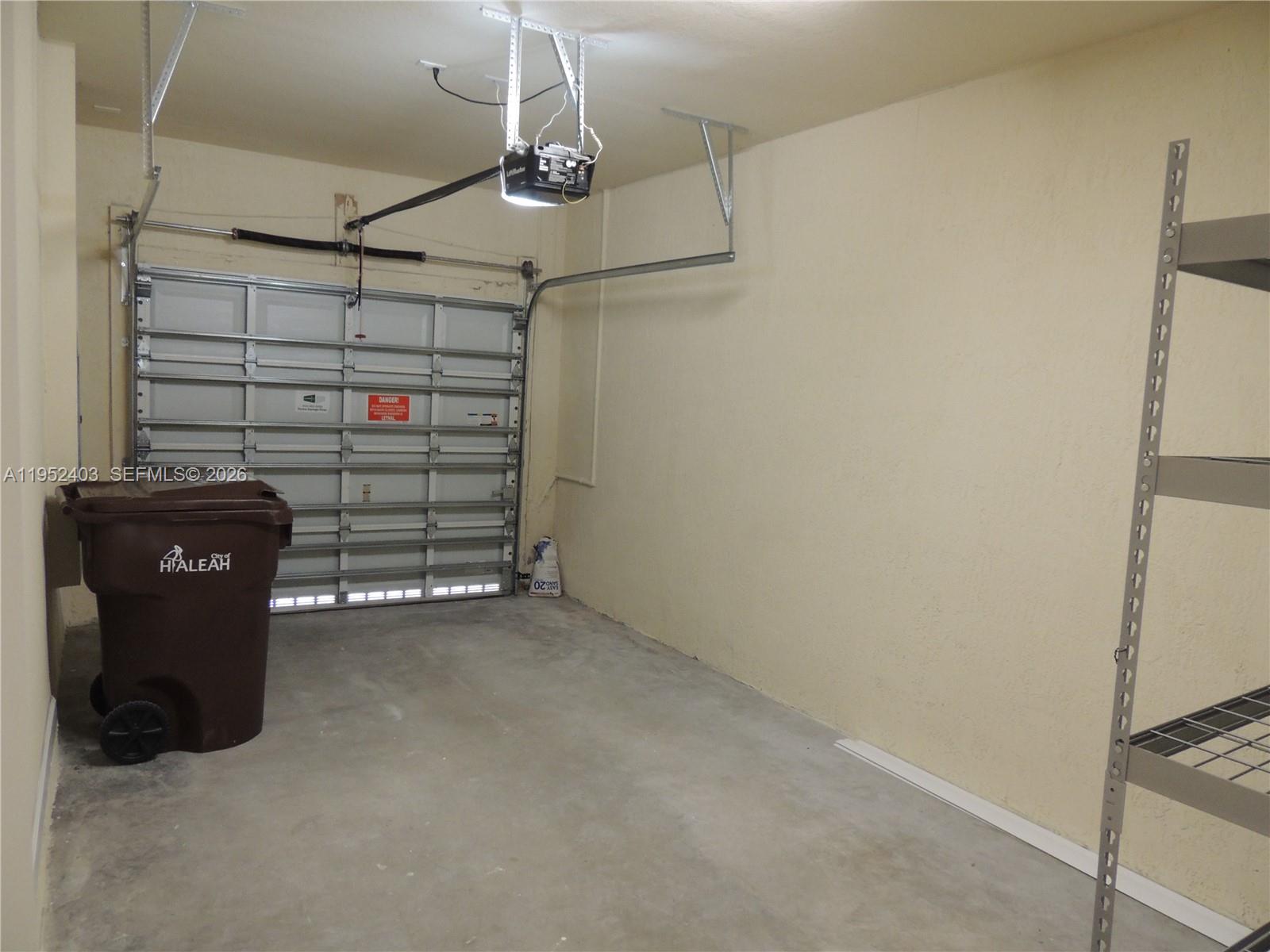 3344 West 91st Terrace, Unit 3344 Hialeah, FL 33018 - Photo 12 of 22 a view of a garage