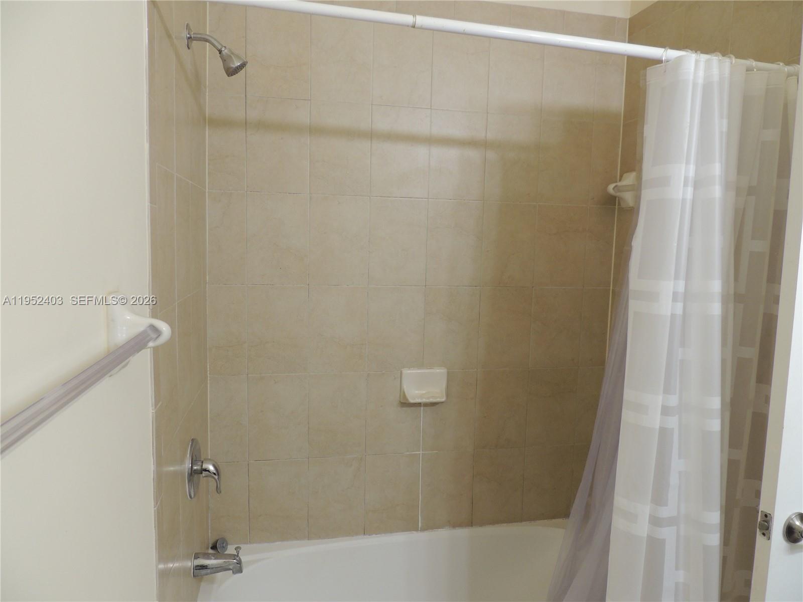 3344 West 91st Terrace, Unit 3344 Hialeah, FL 33018 - Photo 20 of 22 a bathroom with a shower