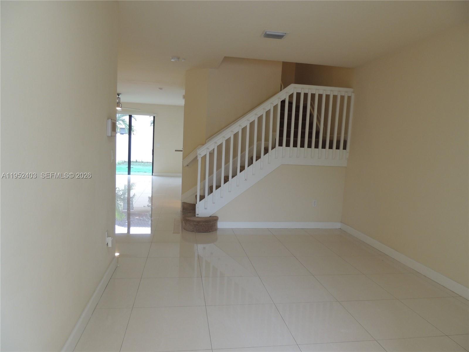 3344 West 91st Terrace, Unit 3344 Hialeah, FL 33018 - Photo 2 of 22 a view of an entryway with wooden floor