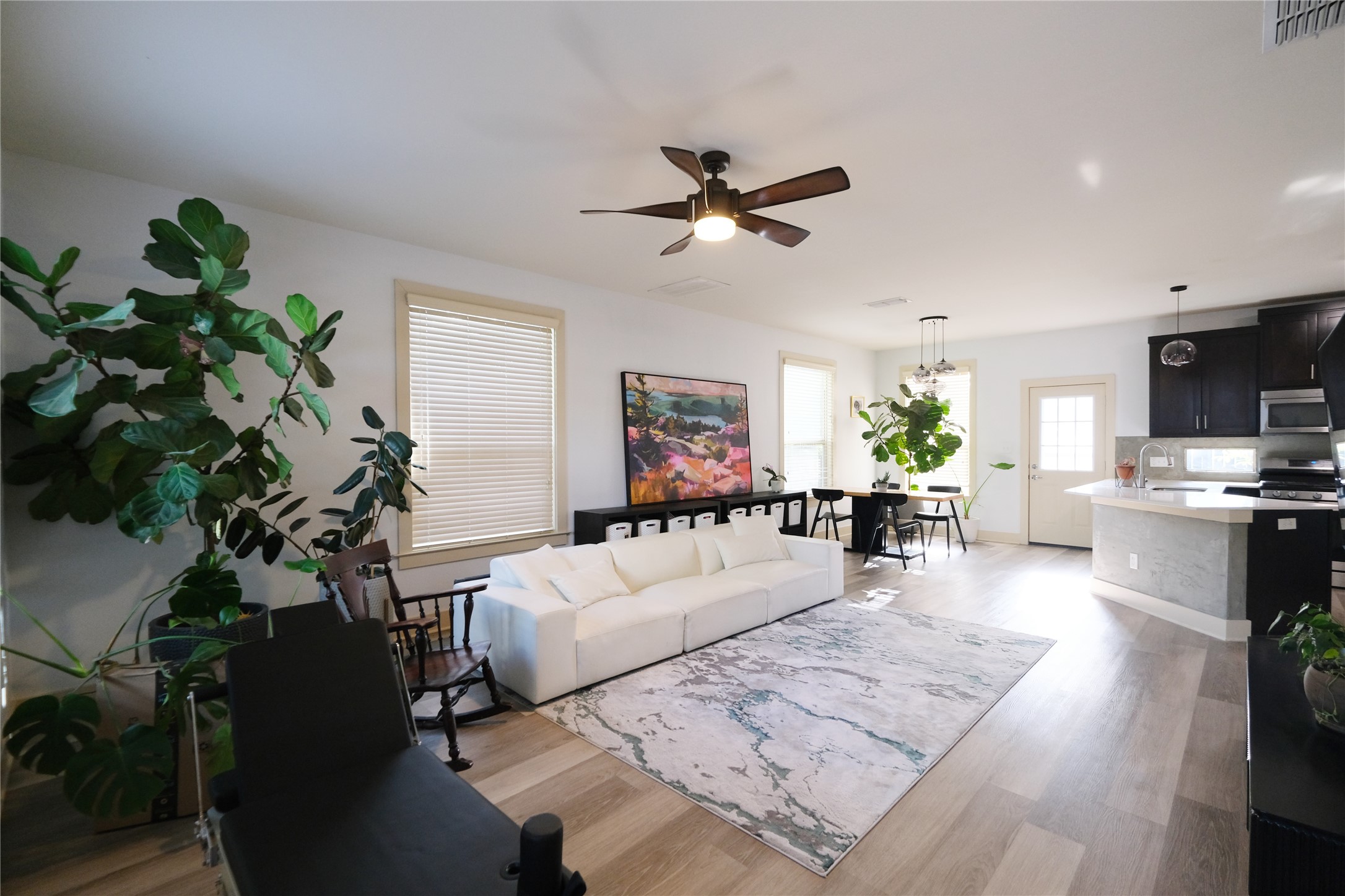 604 Allen Street, Unit 104 Austin, TX 78702 - Photo 1 of 16 a living room with furniture and a potted plant