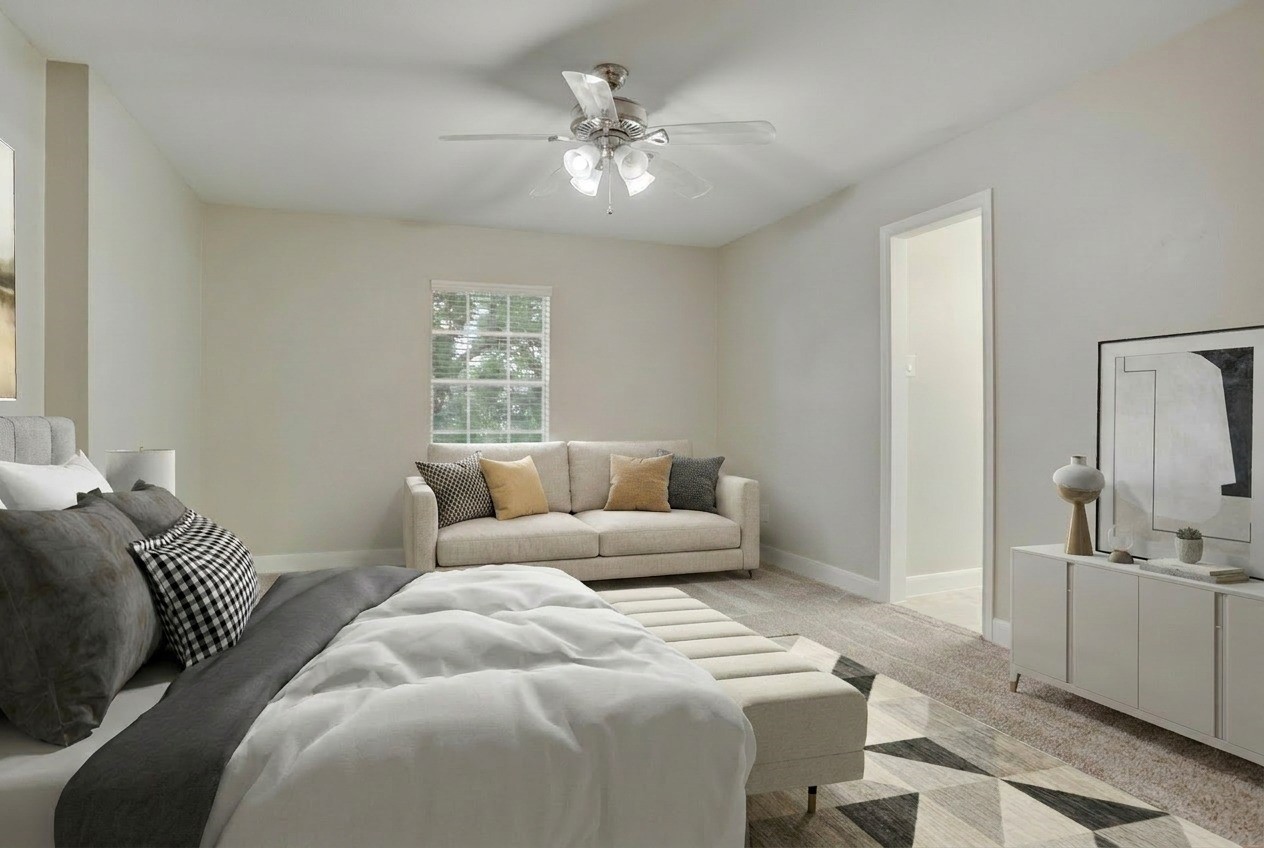 24418 Falcon Point Drive Katy, TX 77494 - Photo 26 of 40 a bedroom with a large bed and ceiling fan