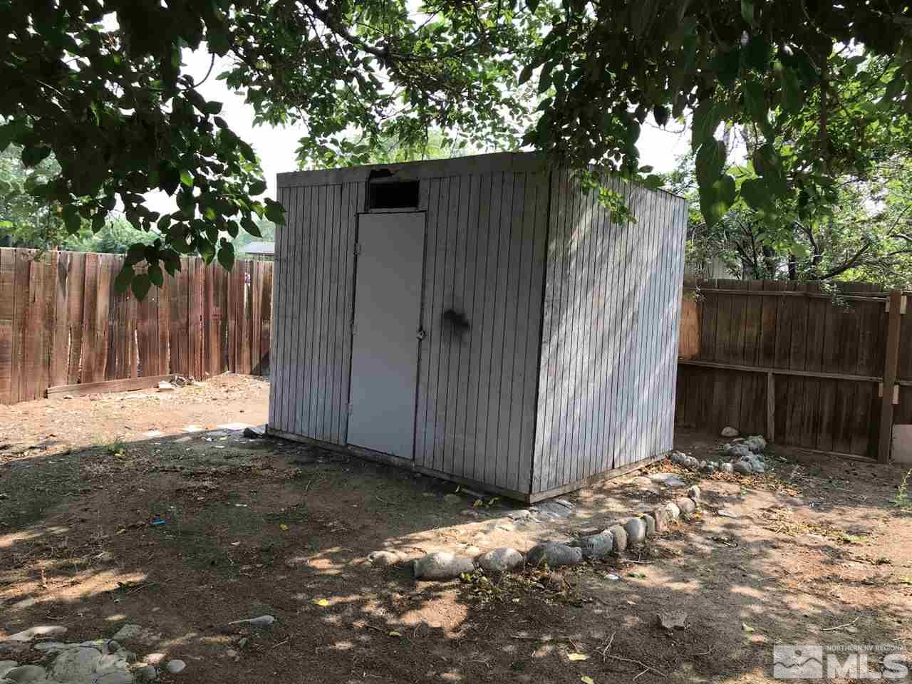 1845 Trainer Way Reno, NV 89512 - Photo 11 of 11 a backyard of a house with plants and trees with wooden fence