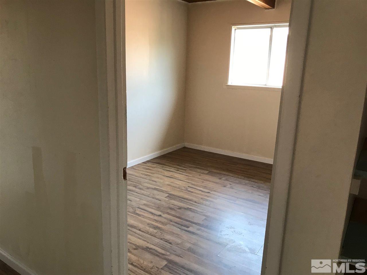 1845 Trainer Way Reno, NV 89512 - Photo 6 of 11 a view of empty room with wooden floor