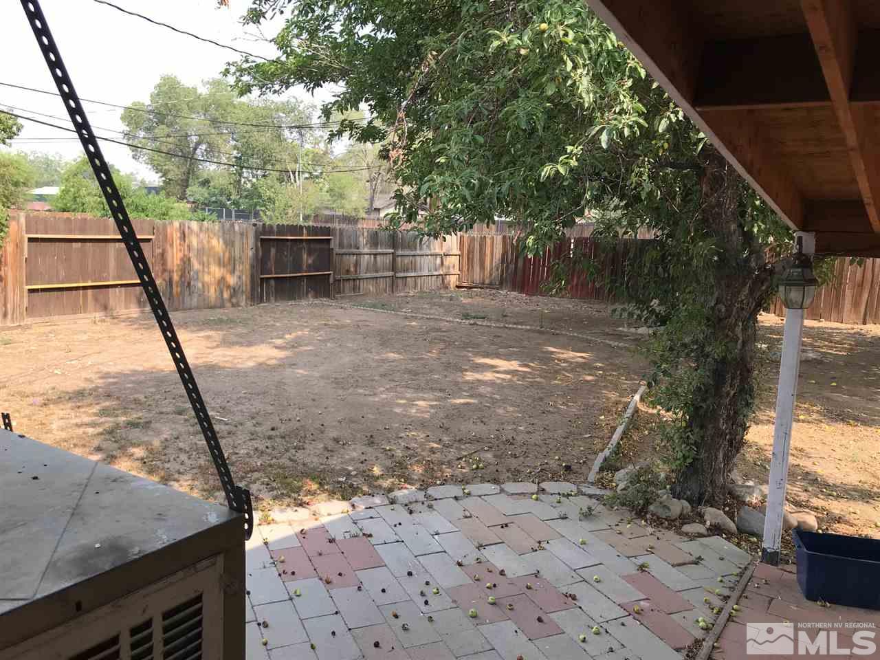 1845 Trainer Way Reno, NV 89512 - Photo 9 of 11 a view of a backyard with large trees