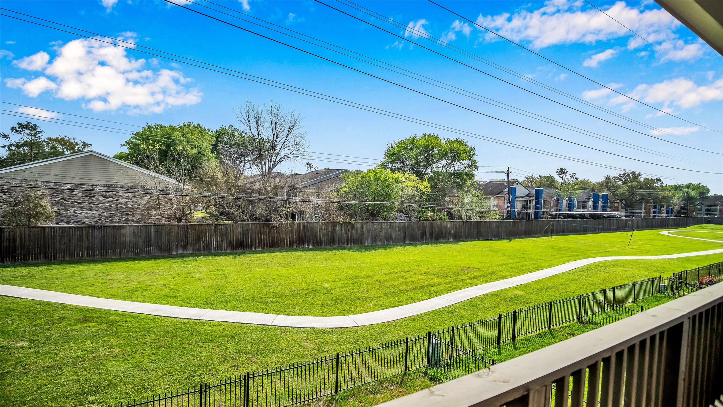 1919 Pueblo Nuevo Path Houston, TX 77077 - Photo 3 of 50 a view of a golf course with a swimming pool