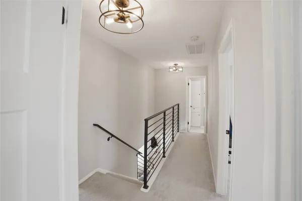 a view of a hallway with windows