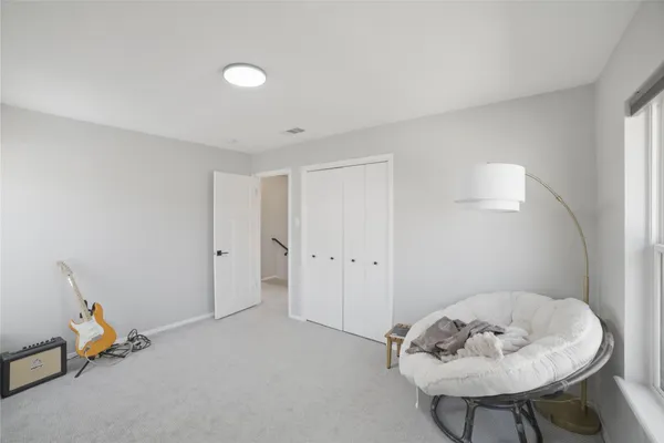 a view of a room with a baby crib