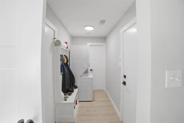 a view of a hallway with stairs