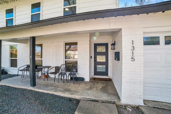 a view of a porch with seating space