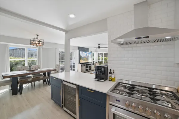 a kitchen with a stove and cabinets
