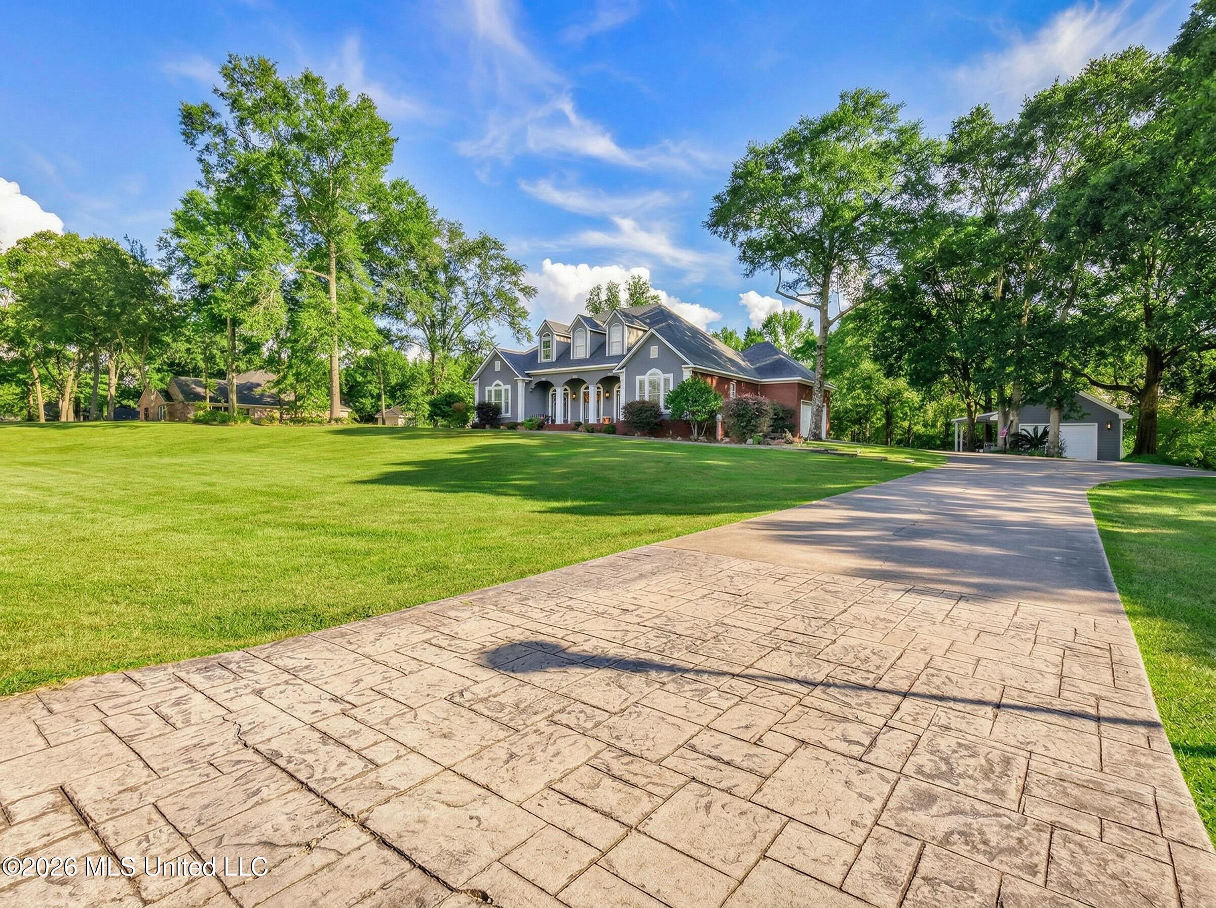 5402 Huckleberry Lane Moss Point, MS 39562 - Photo 58 of 63 make_front_yard_and_trees_gree_Nano_Bana