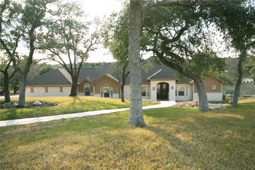 133 Tuscany Way Georgetown, TX 78633 - Photo 1 of 30 a front view of a house with a yard and trees