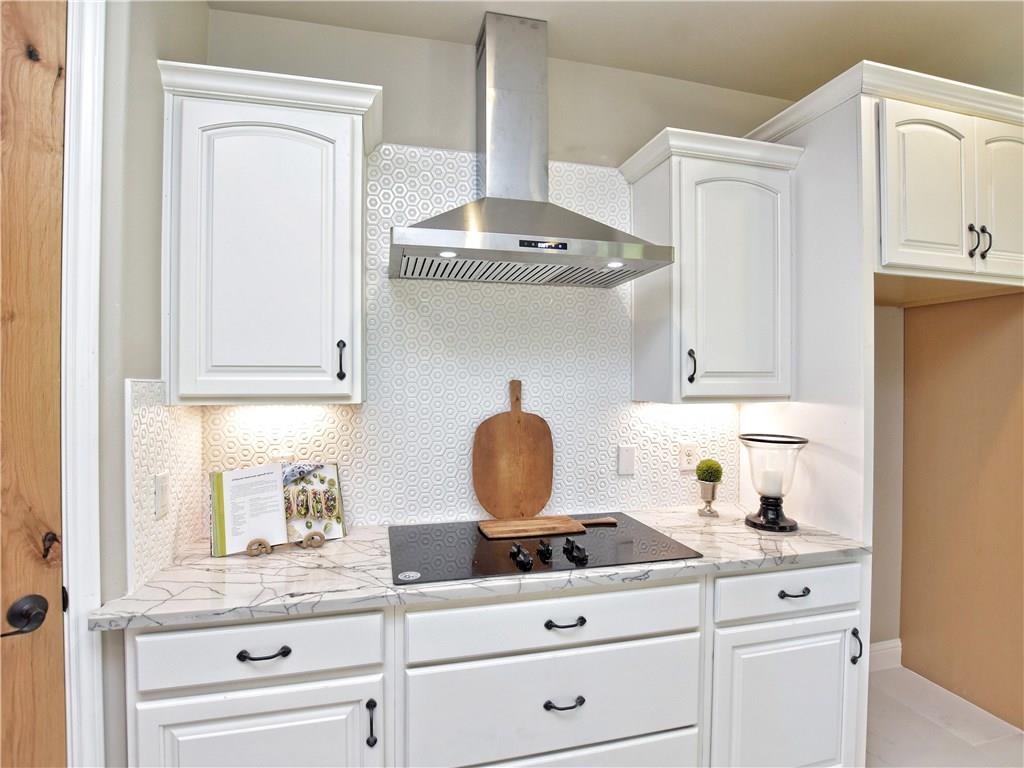 133 Tuscany Way Georgetown, TX 78633 - Photo 13 of 30 a kitchen with appliances cabinets and a counter space